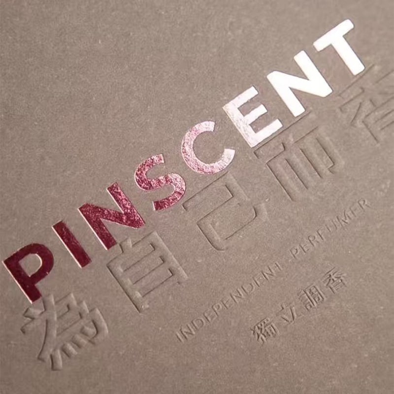 a hot foil stamping logo with a registered embossing slogan