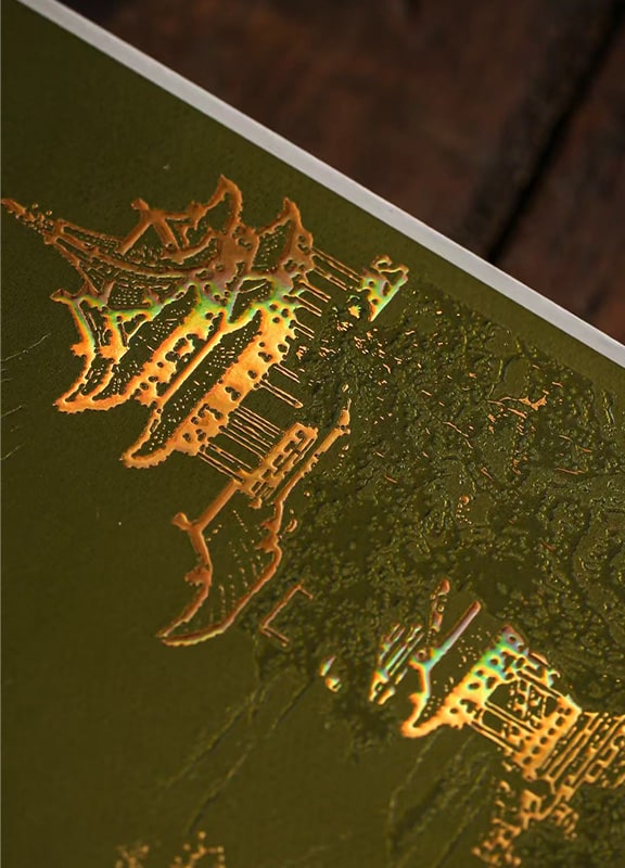 Luxury rigid box with gold hot foil stamping on Chinese tower graphics, showcasing premium metallic finish and elegant packaging design.